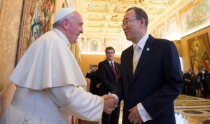 Pope Francis shakes hands with U.N. Secretary General Ban during a meeting at the Vatican
