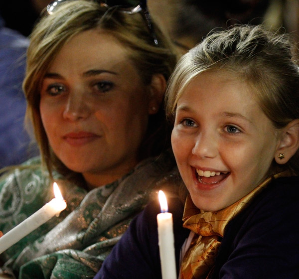 Luisana Puocci and Elise Natale, 10, attend an Oct. 4 prayer vigil led by Pope Francis for the extraordinary Synod of Bishops on the family in St. Peter's Square at the Vatican. (CNS/Paul Haring)